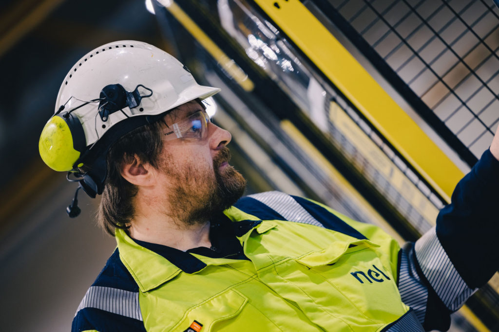 Torgeir, a Nel engineer from the side in a factory